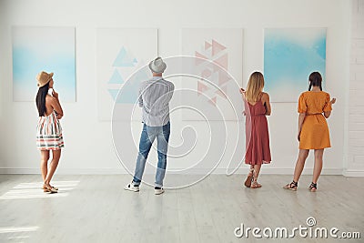 Group of people at exhibition in art gallery Stock Photo