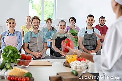 Group of people and female chef Stock Photo