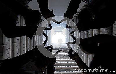 Group of people forming star shape with their fingers in successful business teamwork and unity or network connection concept in Stock Photo