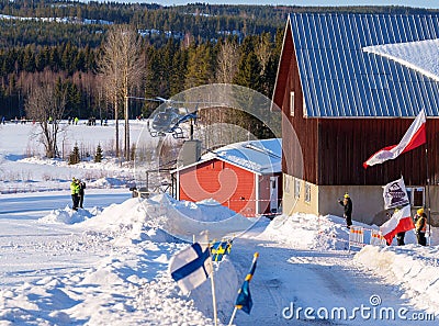 Group of people gathered around the race track in Umea during the winter rally. Editorial Stock Photo