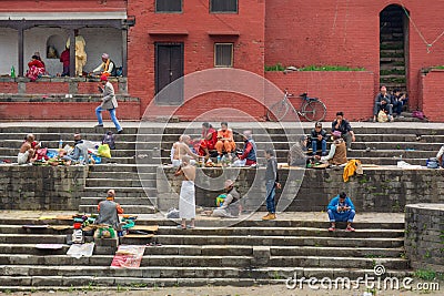 Group of people gathered on the stairs of the temple Editorial Stock Photo