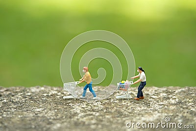 Group of people go to shopping with maintain their physical distance. Miniature people figurines toys conceptual photography Stock Photo