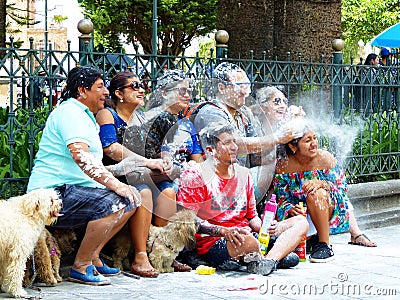 Group of people have fun, take photo and spray foam Editorial Stock Photo