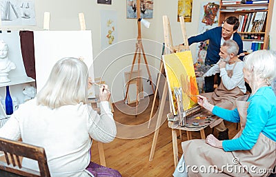 Group of people having lesson in painting school Stock Photo