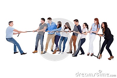 Group of people having a tug of war Stock Photo
