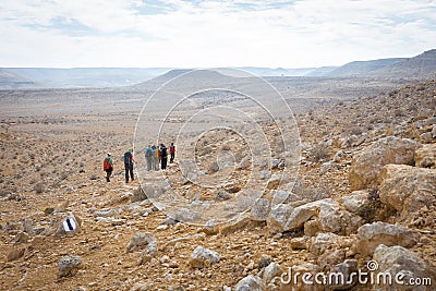 Group people hiking desert trail. Editorial Stock Photo