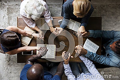 Group of people holding hands praying worship believe Stock Photo