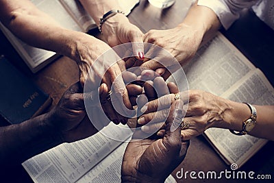 Group of people holding hands praying worship believe Stock Photo