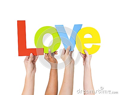 Group Of People Holding The Word Love Stock Photo