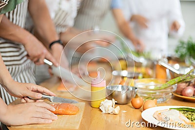 Group of people learning how to cook at master class Stock Photo