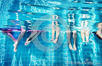 Group of people legs underwater Stock Photo