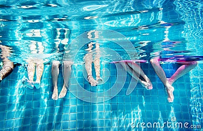 Group of people legs underwater Stock Photo