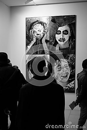 Group of people look at the artwork in Maison Europeenne de la Photographie museum in Paris, France Editorial Stock Photo