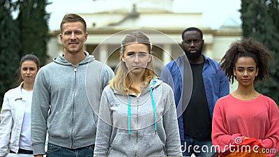 Group of people looking at camera, massive meeting for healthcare reform Stock Photo