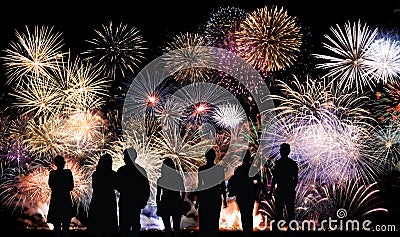 Group of people looks beautiful colorful holiday fireworks Stock Photo