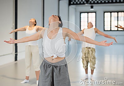 Group of people performing relaxing dance Stock Photo