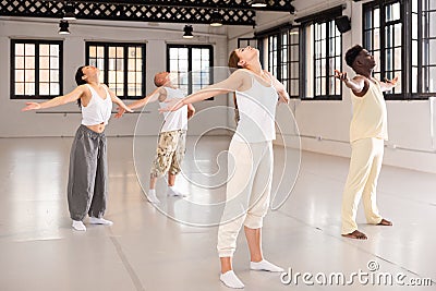 Group of people performing relaxing dance Stock Photo