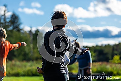 Group of people practicing positions in yoga class Editorial Stock Photo