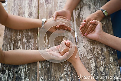 Group of people praying together Stock Photo