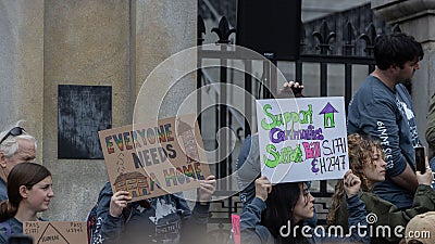 Group of people protesting for social equity and affordable housing in the streets of Boston, USA Editorial Stock Photo