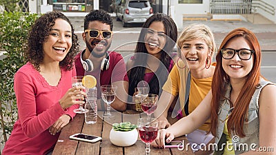 Group of people socializing in a party at restaurant outside. Stock Photo