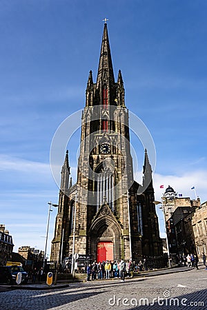 Group of people standing in front of The Hub, formerly known as Tolbooth Kirk in Edinburgh Editorial Stock Photo
