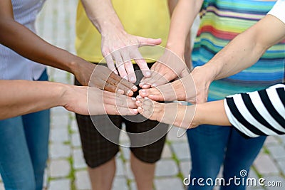 Group of people touching hands in a circle Stock Photo