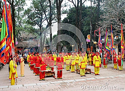 Group of people in traditional costume give gifts to the holy Editorial Stock Photo