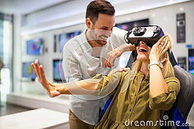 Group of people using virtual reality headset at exhibition, show. VR technology simulation concept Stock Photo