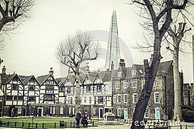 Photo of people walking in front of a towering London landmark Stock Photo