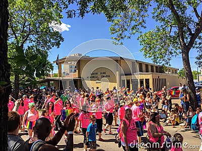 A group of people walking in the gay pride parade near Whyte Avenue, in Edmonton, Alberta, Canada. Many our young families. Peop Editorial Stock Photo