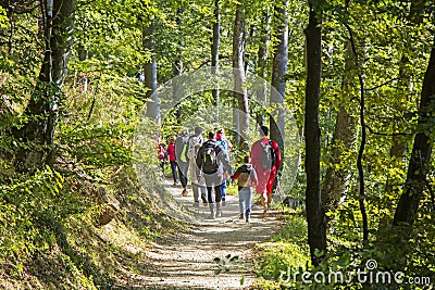 Group of people walking by hiking trail Editorial Stock Photo