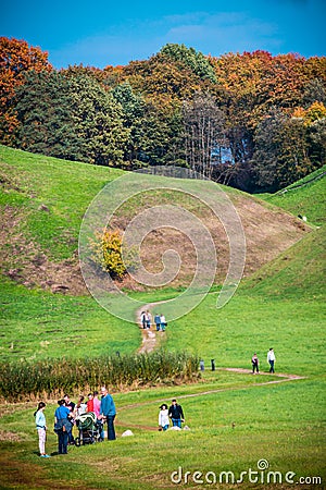Group of people walking near Kernave hills Editorial Stock Photo