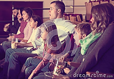 Group of people watching exciting movie Stock Photo