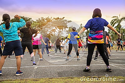 Group of people, woman exercising with aerobics dancing in the garden Editorial Stock Photo