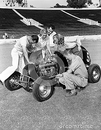 Group of people working on racecar Stock Photo