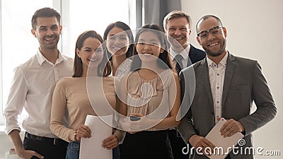 Group picture of happy diverse colleagues in office Stock Photo