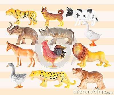 Group of plastic animal doll on color background Stock Photo