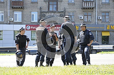 Group of policemen standing on a street and communicating. May 25, 2013. Kiev Ukraine Editorial Stock Photo