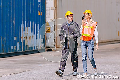 Group of Port Container Ship Yard Colleague Workers working together join teamwork control operate solving problem Stock Photo