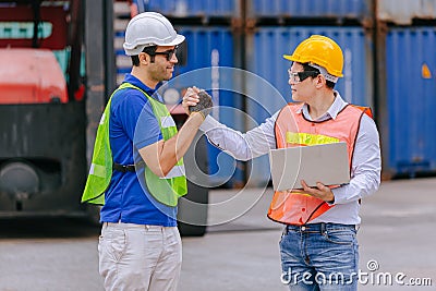 Group of Port Container Ship Yard Colleague Workers working together join teamwork control operate solving problem Stock Photo