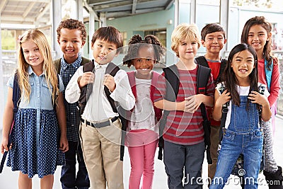 Group portrait of elementary school kids in school corridor Stock Photo