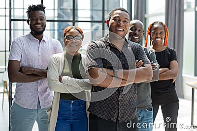 Group portrait of five african business colleagues standing in a row in office Stock Photo