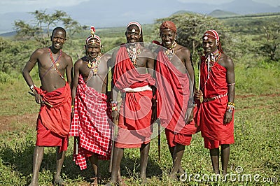 Group portrait of five Masai Warriors in traditional red toga at Lewa Wildlife Conservancy in North Kenya, Africa Editorial Stock Photo