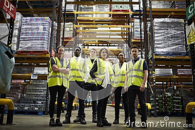 Group portrait of staff at distribution warehouse, low angle Stock Photo