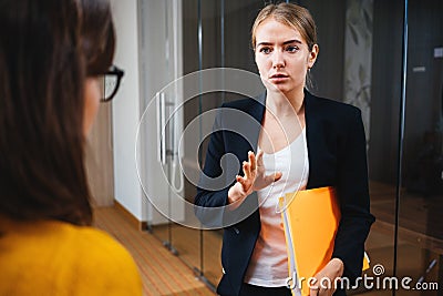 Group of positive female office employees have meeting at workplace at modern office Stock Photo