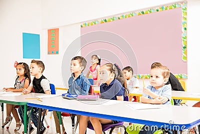 Preschool students paying attention to class Stock Photo