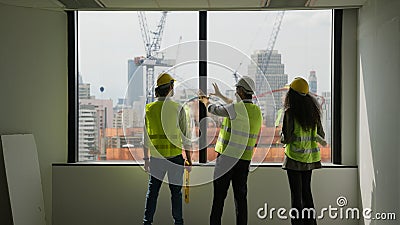 Group of professional civil engineers team working on new building Stock Photo