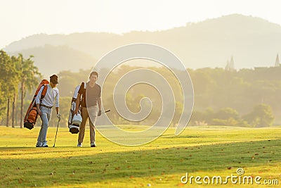 Group Professional Golfer asian man walking in fairway with bag golf with multiethnic club. Hobby in holiday and vacation with fr Stock Photo