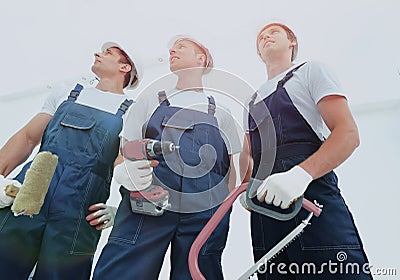 Group of professional industrial workers. Isolated over white background. Stock Photo